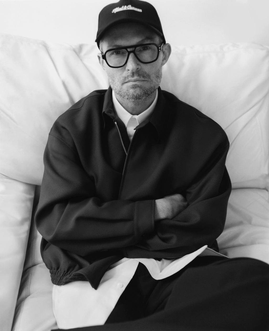 Various persons wearing or Kent and Curwen looks, to illustrate the brand.
